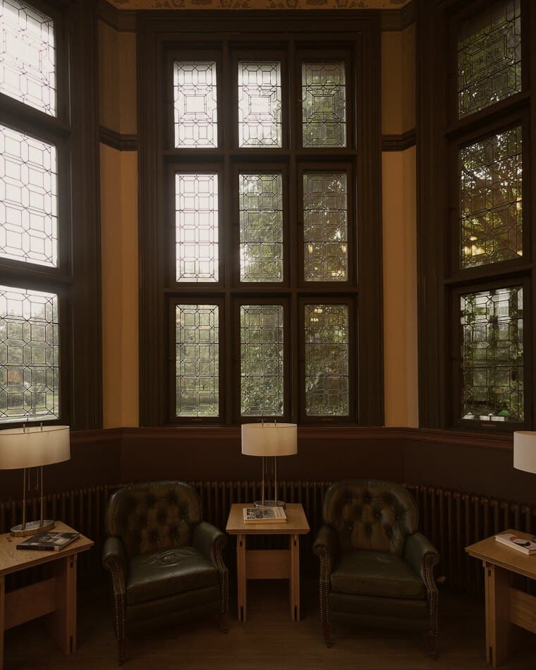 A quiet reading room with tall windows